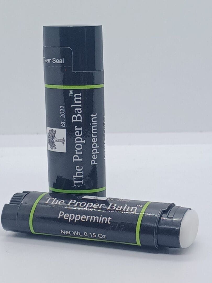 Two tubes of the proper balm are sitting on a table.