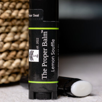 Lip balm labeled "The Proper Balm" tube.