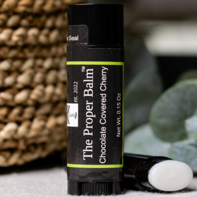 Lip balm tube labeled "Chocolate Covered Cherry".