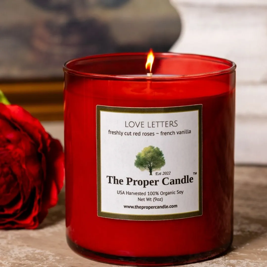 Lit red Love Letters scented candle
